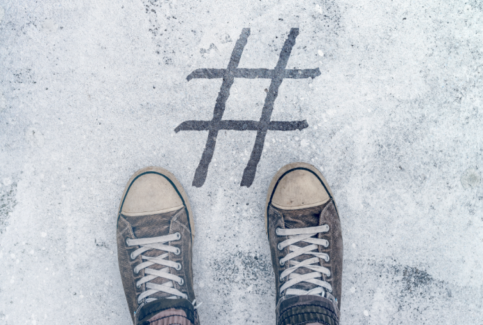 Social Media-Girls standing over hashtag concept